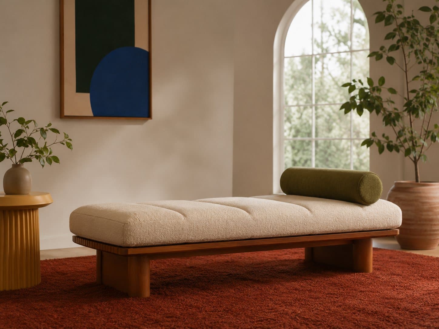 The Ola daybed: a long low bouclé bench on a walnut base
